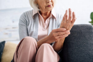 senior woman with arthritis hand pain hermosa beach massage